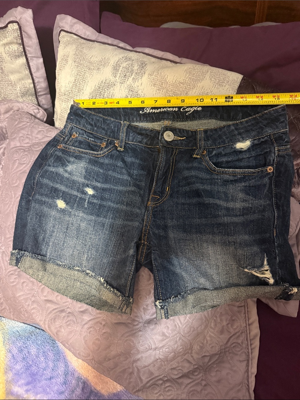 American Eagle Outfitters blue distressed denim rolled-hem shorts
